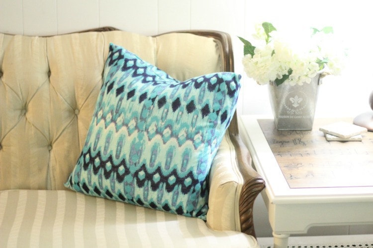 A Cheap Fabric colorful stack of affordable fabrics, including cotton and polyester blends, neatly folded on a table, ideal for budget-friendly sewing and crafting projects