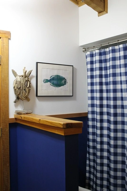 Modern bathroom makeover featuring a sleek vanity, tiled shower, and elegant lighting, showcasing a stylish transformation.