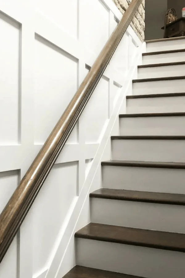 A vibrant DIY staircase makeovers featuring colorful painted steps and modern decor, transforming a home's interior with creative design.